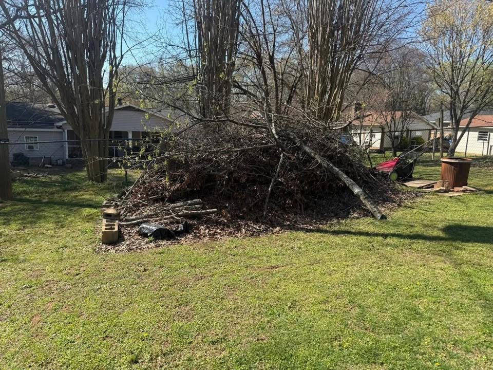 Large pile of brush and yard debris before removal